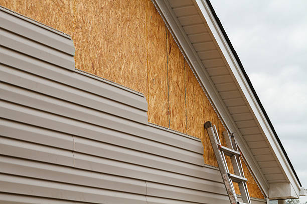 Professional Siding Repair technician working in Commerce City, CO